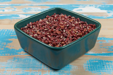 bowl with black-eyed beans on blue rustic wooden table, up viewの写真素材