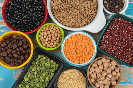 assorted bowls with raw grain and seeds viewed from aboveの写真素材
