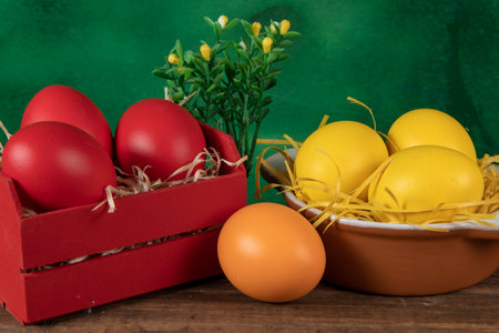 eggs in wooden box with hay on rustic background or surface, easter or holiday concept, high angle viewの写真素材
