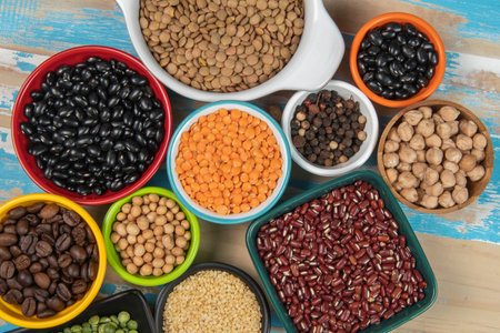 assorted bowls with raw grain and seeds viewed from aboveの写真素材