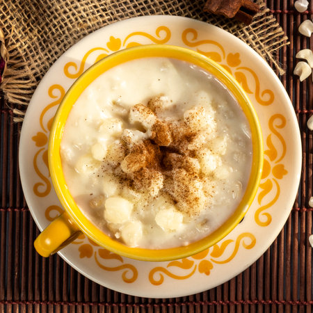 Typical Brazilian sweet dessert, Canjica. White corn porridge with cinnamon and coconut. Consumed in June festivities (Festa Junina)の写真素材