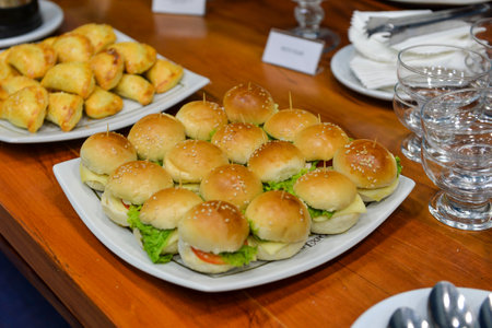 Mini sandwich types to serve at a party on a tray on the tableの写真素材