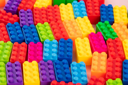 Plastic building blocks isolated on white background. Top view. Flat lay.の写真素材