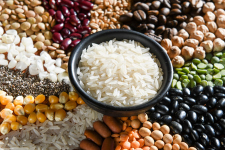 Bowl with raw white rices on various seedsの写真素材