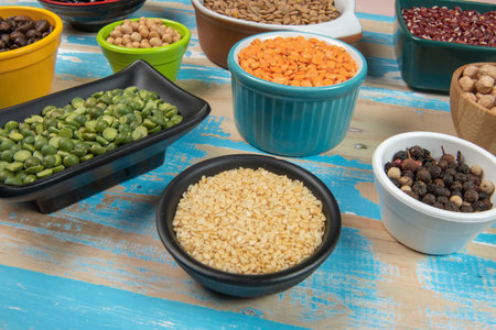assorted bowls with raw grain and seeds viewed from aboveの写真素材