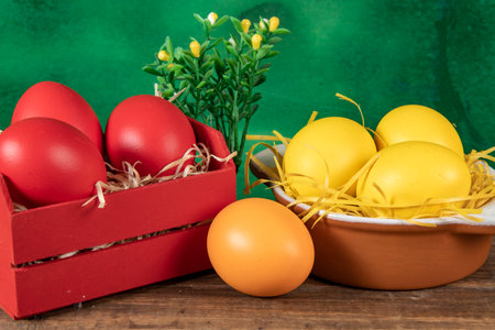 eggs in wooden box with hay on rustic background or surface, easter or holiday concept, high angle viewの写真素材