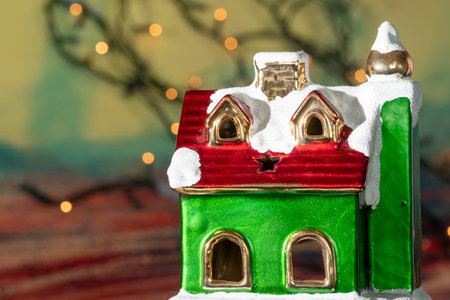 Christmas decoration with toy house on bokeh background, closeupの写真素材