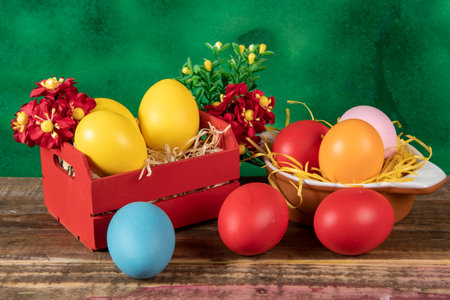 eggs in wooden box with hay on rustic background or surface, easter or holiday concept, high angle viewの写真素材