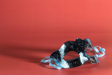 Venetian carnival mask forming frame in one of the lower corners with space for textの写真素材