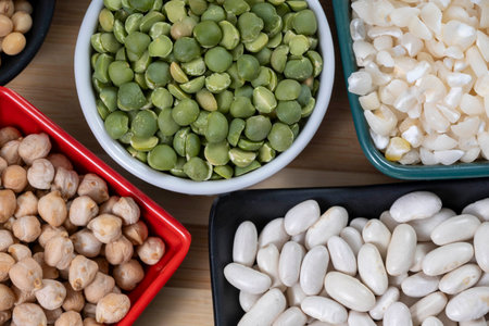several bowls with raw grains for preparing culinary dishes, top viewの写真素材