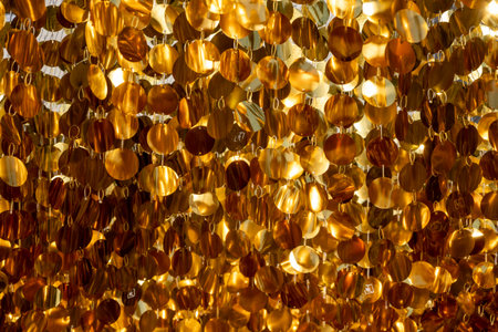 bright yellow round blades reflecting lightの写真素材