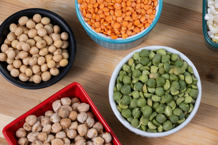 several bowls with raw grains for preparing culinary dishes, top viewの写真素材