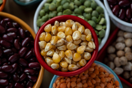 several bowls with raw grains for preparing culinary dishes, top view