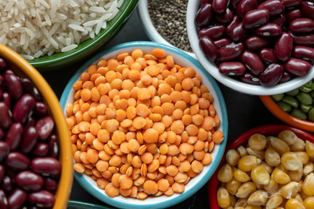 several bowls with raw grains for preparing culinary dishes, top viewの写真素材