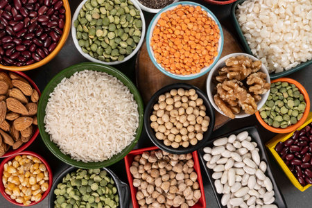 several bowls with raw grains for preparing culinary dishes, top view