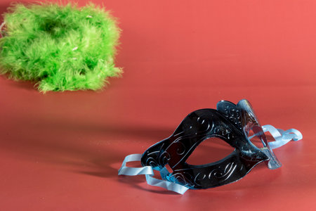 Venetian carnival mask forming frame in one of the lower corners with space for textの写真素材