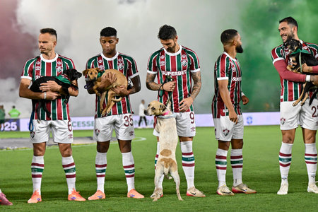 Rio, Brazil - November 27, 2025: Action involving players with dogs for animal adoption during the game between Fluminense 6 x 0 Sao Paulo by 36th round of Brazilian Championship at the Maracana stadiumのeditorial素材