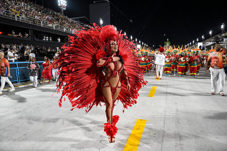 Rio de Janeiro, Brazil - February 13, 2026: A performer from Unidos de Bangu samba school parades at...