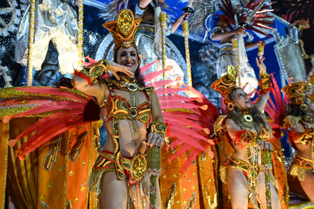 Rio de Janeiro, Brazil - February 13, 2026: A performer from Unidos de Bangu samba school parades at...