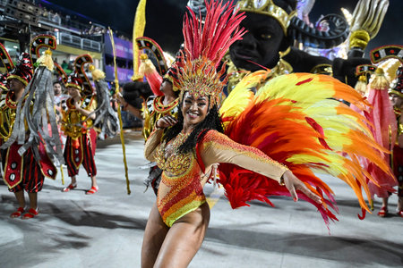 Rio de Janeiro, Brazil - February 13, 2026: A performer from Unidos de Bangu samba school parades at...