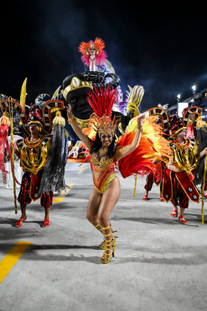 Rio de Janeiro, Brazil - February 13, 2026: A performer from Unidos de Bangu samba school parades at...