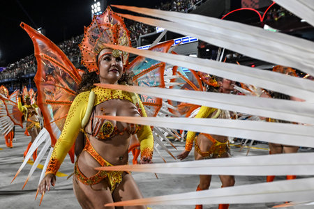Rio de Janeiro, Brazil - February 14, 2026: A performer from Em Cima da Hora samba school parades at...