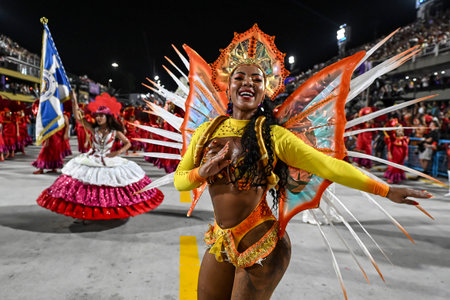 Rio de Janeiro, Brazil - February 14, 2026: A performer from Em Cima da Hora samba school parades at...