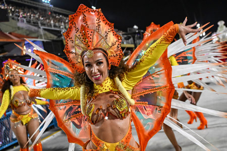 Rio de Janeiro, Brazil - February 14, 2026: A performer from Em Cima da Hora samba school parades at...