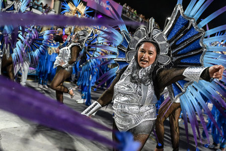 Rio de Janeiro, Brazil - February 14, 2026: A performer from Imperio Serrano samba school parades at...