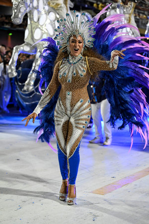 Rio de Janeiro, Brazil - February 15, 2026. A performer Portela samba school parades at the...