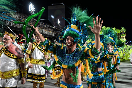 Rio de Janeiro, RJ-Brazil - February 16th 2026, A male dancer wearing a vibrant costume featuring...