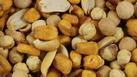mixed salty and spicy nuts. close up.