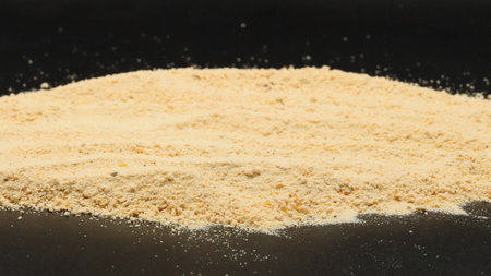 Pile of wheat flour on a black background, close-upの写真素材