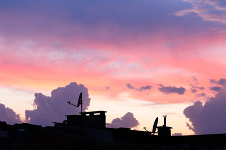 Silhouette of the roof of the building in the sunset.の写真素材