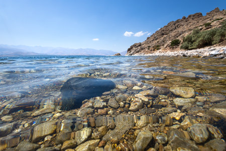Stones in the water of the Van lake, Turkey. The concept of ecological and photo tourismの写真素材