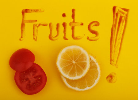 Word Fruits and vegetables on a yellow background. top viewの写真素材