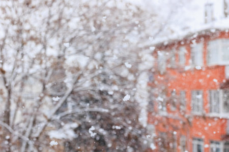 Snowfall in the city. Blurred background, winter landscape.の写真素材