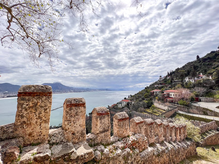 city walls and cityscape of the center of Alanya in Antalya in a cloudy skyの写真素材