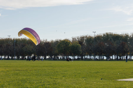 some people training with parachute for paragliding at the Maltepe Coast Park in Istanbul