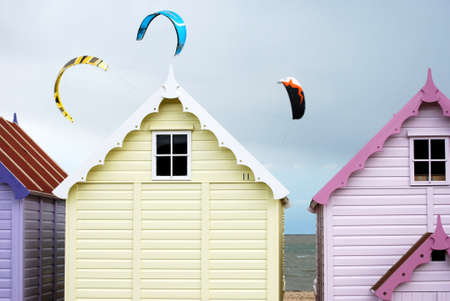 Beach huts with kites in the skyの写真素材