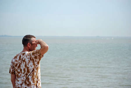 Man looking out to seaの写真素材