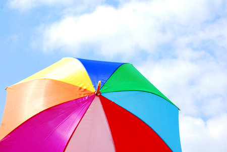 colourful umbrella against blue skyの写真素材