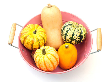 squashes in pink vegetable bowl
