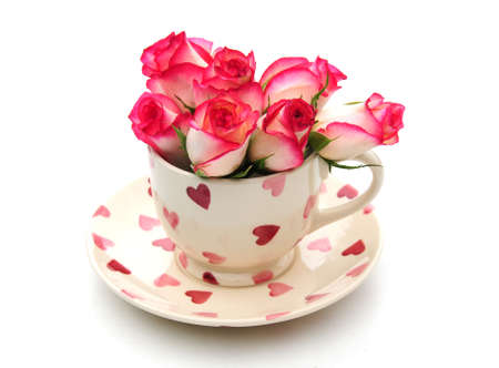 cup and saucer with rosesの写真素材