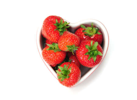Heart shaped dish of strawberriesの写真素材