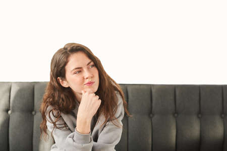 girl is unhappy with something. suspicious woman looking for answers on her questions. copy space, place for textの写真素材