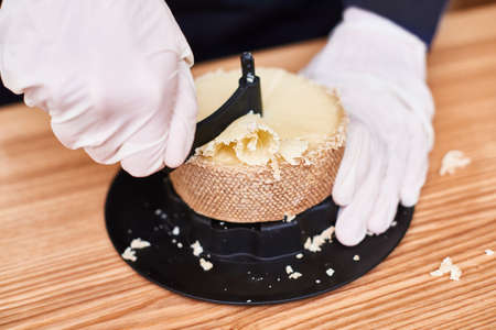 Special cheese knives. The scraper in cheese wheel. Cheese decorationの写真素材