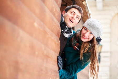 young woman and man looking for adventures and Christmas or New Year's entertainmentの写真素材