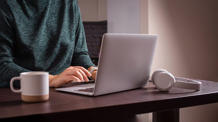 self employed woman work on laptop at home. remote work at home office