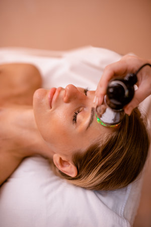 Youthful Revival, Electric Mesotherapy for Radiant Skin Renewal. Wrinkle Reduction with Mesotherapy Deviceの写真素材